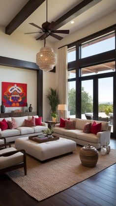 a living room filled with furniture and a ceiling fan