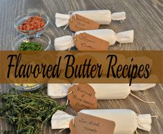 the ingredients for flavored butter are laid out on a wooden table with tags attached to them