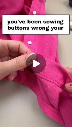 someone is sewsing buttons on a pink piece of clothing with the words you've been sewing buttons wrong your