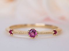 Ruby gold ring, a vintage style ruby wedding ring, a stunning ruby engagement ring, ruby 14K/18K vintage ring.This nature inspired ring is brought to life with a round Ruby set in a floral crown, the band is also embedded with Pink Sapphire. It captures the graceful beauty that nature holds while transporting you to a love story from an older time. #rimonfinejewelry Gold Diamond Ring With Pink Sapphire For Wedding, Gold Pink Sapphire Diamond Wedding Ring, Yellow Gold Ruby Ring With Round Cut Lab-created Ruby, Gold Ruby Ring In 14k For Wedding, Wedding Rings With Diamond Cut Pink Sapphire, Yellow Gold Lab-created Ruby Wedding Rings, Heirloom Ruby Ring In Yellow Gold, Wedding Pink Sapphire Ring In Yellow Gold, Yellow Gold Wedding Ring With Lab-created Ruby