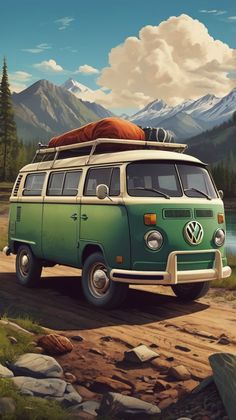 an old vw bus parked on the side of a dirt road with mountains in the background