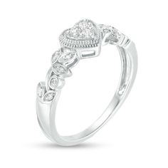 Present her with a romantic token of your affection with this vintage-inspired diamond heart promise ring. Fashioned in sterling silver A heart-shaped composite of round diamonds sparkles in an open frame of intricate milgrain detailing. The sculpted vine-like shank gleams with diamond-touched leaf shapes and bezel-set diamonds. This promise ring captivates with 1/8 ct. t.w. of diamonds. Heirloom Diamond Ring For Anniversary On Valentine's Day, Heirloom Diamond Ring For Valentine's Day Anniversary, Diamond White Heart Ring With Pave Setting For Anniversary, Valentine's Day Anniversary Diamond Ring With Pave Setting, Round Heart Ring With Pave Setting For Anniversary, Pave Setting Heart Ring For Anniversary, Heart Shaped Ring With Pave Setting For Anniversary, Silver Diamond Ring With Accents For Valentine's Day, Heirloom Heart-shaped Diamond Ring For Anniversary