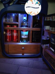 an open refrigerator with drinks in it