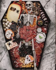 a tray filled with halloween food and decorations