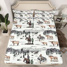 a bed with horses and cactuses on it