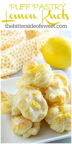 lemon meringue cookies on a white plate next to a lemon and polka dot napkin