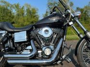 a black motorcycle parked in a parking lot