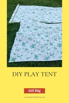 the diy play tent is laying on the grass with text overlay that reads, diy play tent visit blog