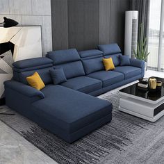 a living room with a blue couch and coffee table