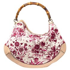 Gucci White/Pink Floral Canvas and Leather Peggy Bamboo Handle HoboHandbags as fabulous as this one are hard to come by. So own this gorgeous Gucci Peggy bag today and light up your closet Crafted from floral canvas and styled with leather trims this stunning number has a spacious canvas interior. It is held by a wonderfully created bamboo handle that makes the piece all the more worthy of being in your closet. Size: Height: 34.5 cm Width: 7 cm Length: 40 cmColour: WhiteMaterial: LeatherCondition: Excellent Floral Canvas, Bamboo Handles, Timeless Handbag, Chic Me, Hobo Handbags, Vuitton Bag, Luxe Fashion, Bags Designer Fashion, Exclusive Bag