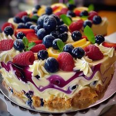 there is a cake with fruit on it