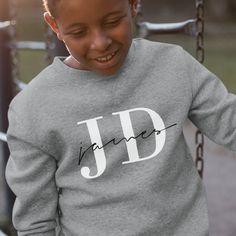 Boys Personalised Name & Initials Sweatshirt. Give a gift with a more personal touch and customised your own unique design. Please use size guide for exact measurements we returns are not accepted on customised products. Each set is made to order and dispatched from the United Kingdom. If you have any questions regarding the customisation, please get in touch and we'll answer any queries you may have. Personalized Cotton Sweatshirt With Name Print, Cotton Sweatshirt With Name Print For Personalized Gift, Custom Print Crew Neck Top For Personalized Gift, Customizable Long Sleeve T-shirt, Personalized Name Print Crew Neck Top, Casual Long Sleeve T-shirt For Personalized Gift, Customizable Crew Neck Top For Personalized Gift, Customizable Casual Tops For Personalized Gifts, Initial Sweatshirt