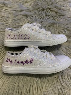 Hand Glittered unbranded canvas sneakers glittered in a gorgeous chunky white mix called *bungalow* with purple glitter personalization of your choice. Shown with white glitter trim, optional. Made to order. Glitter is high quality and heat set for minimal glitter loss and lasting quality, though, you may see glitter shedding the first time you wear/try on your shoes. Although we aim to remove every loose piece of glitter prior to shipment, the shipping process s well as putting them on and adju Bedazzled Wedding Sneakers, Low-top Glitter Sneakers For Wedding, Xhosa Traditional Wedding Dresses, White Low-top Sneakers With Glitter Accents, Purple Glitter Low-top Sneakers, Wedding Lace-up Sneakers With Rhinestones, Synthetic Low-top Sneakers With Glitter Accents, Sparkle Sneakers, Wedding Tennis Shoes