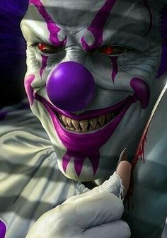 a creepy clown holding a knife in his hand