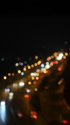 blurry image of city lights at night from the top of a building in an urban area