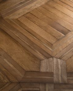 the floor is made up of wood planks and has an interesting pattern on it