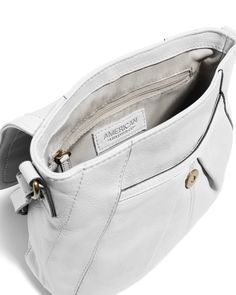 The Ria N/S Crossbody has gently curved lines and tucks for a slim, small crossbody bag that is perfect for everyday use. Genuine leather Exterior: 1 slip pocket under front flap and back slip pocket with magnetic snap Interior: 1 zipper pocket and 2 slip pockets Adjustable strap: 46.25" - 52.25" Dimensions: 11"L x 3.5"W x 9"H Weight approximately: .8 lbs Classic Crossbody Satchel With Cell Phone Pocket, Classic Crossbody Shoulder Bag With Cell Phone Pocket, Classic Shoulder Bag With Magnetic Closure For On-the-go, Classic Soft Leather Crossbody Flap Bag, Classic Satchel Shoulder Bag With Pockets, Versatile Crossbody Flap Bag With Magnetic Closure, Classic Flap Shoulder Bag For On-the-go, Classic Crossbody Bags With Pockets, Casual Leather Flap Bag