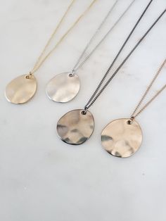 "Simple Geometric Wave Plate Pendant Long Necklace Chain Length: 24″ + 2\" Adjustable Extension. Total 26\" Clasp: Yes Type of Clasp: Lobster Claw Pendant Length: 7/8\" Pendant Width: 3/4\" Weight: 6g Metal: Rhodium or gold plated chain, brush metal pendant, tarnish resistant Options: Silver Gold  Gunmetal Champagne" Silver Jewelry With Delicate Brass Chain, Silver Brass Chain Necklace With Delicate Chain, Silver Brass Necklace With Adjustable Chain, Teardrop Shaped Silver Brass Necklace, Silver Brass Teardrop Necklace, Nickel-free Metal Teardrop Pendant Jewelry, Modern Nickel-free Teardrop Pendant Jewelry, Silver Brass Charm Necklace With Adjustable Chain, Everyday Metal Jewelry With Large Pendant