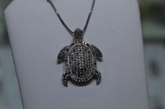 White and Green Zircon gem covered turtle pendant necklace Diamond Large Pendant Jewelry Gift, Costume Jewelry With Rhinestones For Gifts, Cubic Zirconia Stone Pendant Jewelry, Cubic Zirconia Pendant Jewelry With Stones, Crystal Pendant Jewelry With Stones, Sterling Silver Necklace With Bling As Gift, Sterling Silver Necklace With Bling For Gift, Sterling Silver Bling Necklace For Gift, Unique Crystal Jewelry With Rhinestones