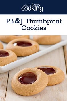 peanut butter and chocolate chip cookies on a white plate with text overlay reading pb & j thumpprint cookies