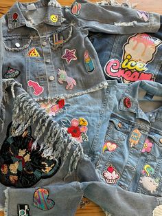 These patch jean jackets will make a statement! Each patch is individually SEWN into the jacket. These personalized jackets are great as gifts, parties, holidays, or just everyday wear.  Please know that your jacket might vary slightly from what is pictured. The brand/wash/color will vary based on the size and what stock we have. If you like the jean fringe jacket please be specific in your personalization. This item may take longer to ship. Depending on size ordered- the fringe jean jacket might be different from pictured. I'll be happy to send a picture of what's in stock before you order.  I have such a wide variety of patches. I can usually customize whatever look you're going for! Please include your child's interests: sports, animals, music, dance, shapes, favorite foods/fruits/desse Trendy Patched Denim Jacket, Trendy Cotton Denim Jacket With Patches, Cotton Denim Jacket With Patches For Winter, Winter Cotton Denim Jacket With Patches, Trendy Cotton Denim Jacket With Embroidered Patch, Trendy Denim Jacket With Patches, Trendy Long Sleeve Denim Jacket With Patches, Multicolor Denim Outerwear With Patches, Trendy Denim Outerwear With Embroidered Patch