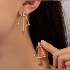 Main Material: 18k Gold Plated Zinc Alloy With Synthetic Gemstones Brand New Earring Needle Material: Iron Dimensions: L - 1.57in // W - 0.98in Bundle 2 Or More Items For A Special Discount And Save On Shipping! Pink Earrings With Dangling Charms, Valentine's Day Dangling Charms Drop Earrings, Pink Gold Plated Pierced Earrings, Pink Tarnish Resistant Drop Earrings, Pink Gold-plated Pierced Earrings, Pink Tarnish-resistant Drop Earrings, Elegant Heart Earrings With Dangling Charms As Gift, Valentine's Day Tarnish Resistant Dangle Earrings, Pink Dangling Charms Drop Earrings