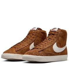 Suede upper Leather swoosh and heel tab Padded mid top collar Exposed foam tongue Vulcanized midsole Rubber outsole Color: Light British Tan/Sail/Hyper Crimson Style: HF3157-200 Nike Blazer Blue, Nike Blazer Women, Nike Brown, Nike Blazer Mid 77, Nike Blazer Mid, Nike Blazers Mid, Blazer Mid, Mid Top, Latest Sneakers