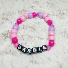 ٭⊹ UV Reactive ⊹٭  10 year old twins K & K are trying to raise money to fly from AZ to NY to see their best friend after she moved 2 years ago   ٭⊹ 🅤🅥  ⊹٭ ✿ 100% designed and handcrafted by K & K themselves ✿ Bracelet is a size:  (please see sizing chart below)  ✿ Please measure your wrist to ensure fit before purchasing. Bracelets are made with elastic bands. Again, the size provided is with the bracelet unstretched.  ⋆⋅ Size Chart ⋅⋆  Small * 16cm-19cm Med * 19cm-22cm Large * 22cm-25cm ꧁*⊹٭  TᕼᗩᑎK YOᑌ  ٭⊹*꧂ Themed Pink Bracelets For Birthday, Personalized Pink Novelty Bracelets, Pink Themed Birthday Bracelets, Customizable Pink Fun Bracelets, Fun Customized Pink Bracelets, Pink Handmade Themed Bracelets, Novelty Pink Personalized Friendship Bracelets, Themed Handmade Pink Bracelets, Personalized Pink Novelty Friendship Bracelets