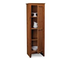 a tall wooden cabinet with two shelves and plates on it's bottom shelf, against a white background