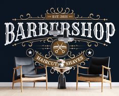 barbershop logo with chairs and table in front of dark blue wallpapered room