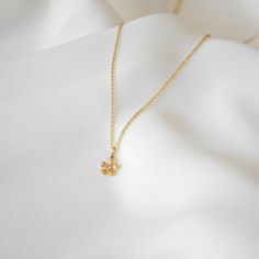 A lifetime piece, this necklace is made of all 14k gold and features a lovely Cosmos flower with a bright diamond center. Gift box included. Diamond Weight: 0.045 Carat Color: G Quality: SI-VS Non-Conflict Diamonds Chain measures 1 mm in width. Flower measures 7 mm in diameter. --------------------♥ PROMOS ♥-------------------- Want 10% off? Join the mailing list by visiting http://bit.ly/vedern . Your discount code will work on Vedern at Etsy. --------------------♥ BUY WITH CONFIDENCE ♥-------------------- Don't love it? Message me to set up a return or exchange. If you find any problems with your items, just send a message with a photo, and a new one will be on its way to you! --------------------------♥ PACKAGING ♥--------------------------- Gold filled, vermeil, and sterling silver ite Flower Shaped Diamond Necklace For Gift, Gold Diamond Necklace In Flower Shape For Gift, Gold Diamond Necklace With Flower Shape For Gifts, 14k Gold Flower Charm Necklace With Pendant, Yellow Gold Diamond Flower Pendant Necklace As Gift, Yellow Gold Diamond Necklace With Flower Pendant As Gift, Dainty Diamond Necklace With Flower Charm, Dainty 14k Gold Diamond Necklace With Flower Pendant, Elegant Flower-shaped Diamond Necklace As Gift