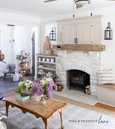 a living room filled with furniture and a fire place