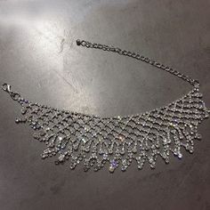 Wear this with a low neckline dress.  Perfect for formal parties  Tassel details  Adjustable Dazzling Choker Necklace For Party, Dazzling Choker For Parties, Dazzling Choker For Party, Sparkling Choker Necklace For Party, Party Rhinestone Choker Necklace With Sparkling Stones, Dazzling Party Choker Jewelry, Dazzling Silver Party Choker, Sparkling Party Choker Necklace, Dazzling Rhinestone Choker Necklace For Party