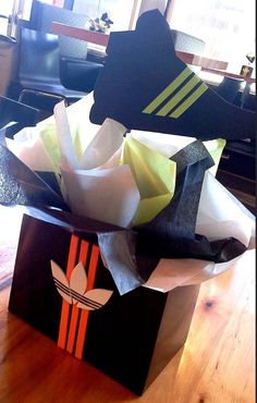 an open shopping bag sitting on top of a wooden table