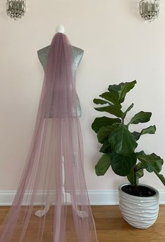 This soft plain veil is made of fine English net and available in lavender, plum or grey colors.  PRODUCT DETAILS: Gather at the comb Soft English Net  One tier veil Designed and Handmade in the USA by TLCoutureatelier PLEASE USE THIS LINK TO ORDER TULLE SAMPLES: https://www.etsy.com/listing/291339927/fabric-swatches-ribbon-color-swatches Copyright © 2023 L&T Couture. All rights reserved. Lavender Tulle Fabric For Wedding, Lavender Veil, Plain Veil, Chapel Veils, Color Veil, Plum Wedding, Chapel Veil, Wedding Veil Accessories, Savannah Wedding