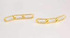 This pair of Sterling Silver (Gold plated/ Rhodium Silver/Rose Gold plated) chain-link-earrings feature a linear drop of three elongated, flat, and equal in size and length links, designed with a standard stud in the top link and embedded on sparkling Cubic Zirconia Stones. The flatted surface area reflects more light, so this type of chain link appears to be brighter and shinier than regular links earrings.The lightweight construction makes these earrings comfortable for all-day wear, and at a Elegant Sterling Silver Link Earrings, Elegant Link Chain Earrings, Elegant Chain Link Earrings, Elegant Link Earrings Tarnish Resistant, Elegant Tarnish Resistant Link Earrings, Elegant Tarnish-resistant Link Earrings, Elegant Link Earrings For Formal Occasions, Elegant Paperclip Earrings, Elegant Formal Link Earrings