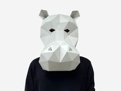 a person wearing a paper mask with the shape of a bear's head