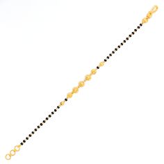 This iconic striped 22k gold bracelet, weighing 4.7 grams, features a stunning yellow gold finish complemented by elegant black beads. Spanning 7 inches in length and equipped with 0.6" adjustable links, it offers a personalized fit, secured by a hook lock. Ideal for those who value classic design with a modern edge, this piece elegantly marries the timeless appeal of gold with the chic contrast of black beads. It stands as a versatile and stylish addition to any jewelry collection, perfect for Traditional Gold Bracelets With Black Beads, Traditional Gold Bracelet With Black Beads, Traditional Gold Beaded Bracelet With Black Beads, Elegant Yellow Gold Bracelets With Black Beads, Elegant Yellow Gold Bracelet With Black Beads, Black Bead Bracelet, 22k Gold Bracelet, Bridal Jewelry Necklace, Precious Stones Rings