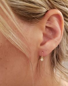 This is a beautiful diamond design earrings. It is set in real solid 14Kt Gold. You can choose if you want 14Kt White Gold, 14Kt Yellow Gold or 14Kt Rose Gold. This is the perfect gift for mom, wife, fiancee, girlfriend, valentine, daughter, family or friend. It is a special gift for mother's day, valentine's day, wedding, anniversary, birthday, Christmas, Easter, New Year's and any holiday. Setting Size: 4.05mm (0.160 inches) 0.04 Ct Total Diamond Weight Clarity: I1-I2 Color: G-H Metal Weight: White Gold Huggie Earrings With Bezel Setting, Delicate Round Diamond Earrings With Single Diamond, Everyday Bezel Set Round Cut Earrings, Gift Diamond White Hoop Earrings With Single Diamond, Gold Dangle Earrings With Single Diamond, Everyday Teardrop Diamond Earrings With Accents, Everyday Huggie Earrings With Bezel Setting, Diamond Hoop Earrings With Bezel Setting As A Gift, Yellow Gold Bezel-set Dangle Diamond Earrings