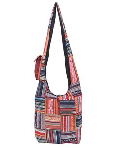 Tote your essentials in boho style with this bold cotton handbag that will add a splash of flash to multiple ensembles. Note: This one-of-a-kind item is handcrafted. Actual colors may be different than shown. Approximate Bag Size: 14" x 3.5" x 13"; Shoulder Strap Length: 22" Lined Interior with side pocket, Top zipper with button fastener 100% Cotton Hand Wash, Hang Dry Made in Nepal Casual Multicolor Patchwork Hobo Bag, Bohemian Cotton Shoulder Bag For Travel, Hippie Multicolor Patchwork Bag, Hippie Cotton Shoulder Bag For Travel, Bohemian Cotton Patchwork Shoulder Bag, Bohemian Patchwork Cotton Shoulder Bag, Hippie Multicolor Patchwork Shoulder Bag, Multicolor Patchwork Hippie Shoulder Bag, Everyday Bohemian Cotton Hobo Bag