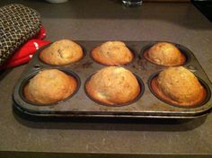 muffins in a pan on a counter top