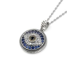 The evil eye symbol has long been associated with good luck and protection, making this necklace a great talisman for anyone who believes in its power. Crafted in sterling silver, it's very fashionable and perfect for everyday wear. This piece features sliver in a halo design that surrounds the blue stones, and a protective evil eye symbol. Whether for a birthday, anniversary, or other special occasions, this necklace makes a great gift for anyone who loves unique, eye-catching jewelry.Carat Wei Spiritual Necklace With Round Pendant And Sterling Silver Clasp, Spiritual Necklace With Sterling Silver Clasp And Round Pendant, Spiritual Round Pendant Necklace With Sterling Silver Clasp, Spiritual Pendant Necklace With Diamond Eyes, White Gold Evil Eye Pendant Necklace, Evil Eye Amulet Pendant Necklace, Evil Eye Pendant Amulet Necklace, Evil Eye Amulet Jewelry, Sterling Silver Evil Eye Jewelry For Good Luck