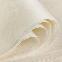 a roll of white paper sitting on top of a table