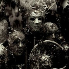 many masks are lined up together in black and white