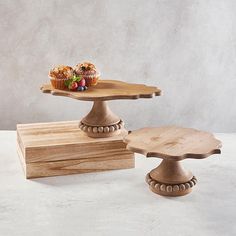 two wooden trays with muffins on them