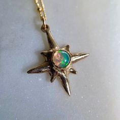 Glittery and dainty, this little star necklace is one of my best sellers and makes for a lovely gift. This classic, timeless design of a compass star is perfect for anyone who needs a reminder of finding their way, listening to their inner voice, guidance and confidence. Stars have often been regarded as protective symbols and are found in jewelry throughout history.  An elegant and minimal choker, perfect for layering with other necklaces or worn on its own.  The Polaris Choker features a mini star, measuring 3/4 x 3/4 inch and hangs on a dotted gold fill chain. The chain is adjustable  between 16-18 inches and is lead and nickel free. Choose your favorite gemstone for the center!  Longer chain lengths are always available at no extra cost, just message me with your order! Also, if you lo Protective Symbols, Compass Star, Minimal Choker, North Star Necklace, Horseshoe Necklace, A Compass, Celestial Necklace, Inner Voice, North Star