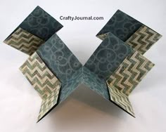 an origami box with geometric designs on it