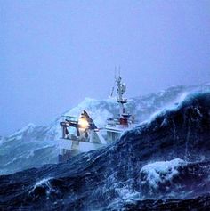 two boats in the middle of a large body of water