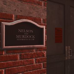 a plaque on the side of a building that says nelson and murdock