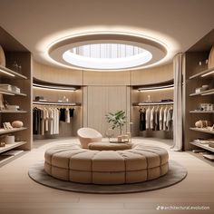 a room that has a round couch in the center and shelves with clothes on them